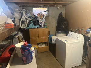 Clothes washing area featuring washer / dryer