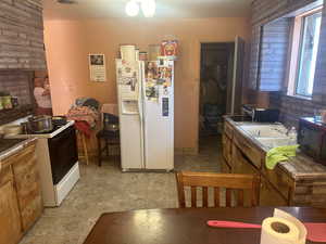 Kitchen with sink and white appliances