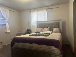 Bedroom #2 featuring cooling unit and hardwood / wood-style floors