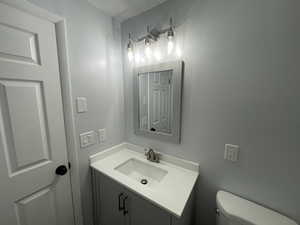 Bathroom with vanity and toilet