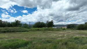 View of landscape featuring a mountain view and a rural view