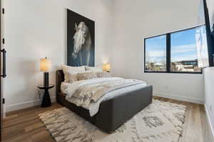 Bedroom featuring wood-type flooring