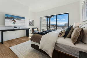 Bedroom with wood-type flooring