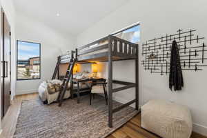 Bedroom featuring wood-type flooring