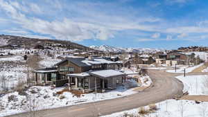 Snowy aerial view with a mountain view