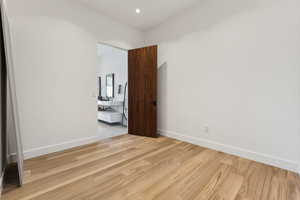 Unfurnished bedroom with light wood-type flooring