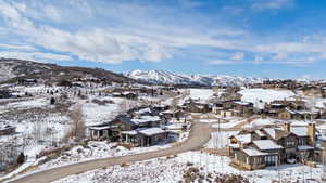 Snowy aerial view featuring a mountain view