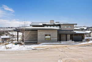 View of front of property featuring a garage