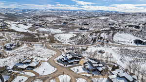 Snowy aerial view with a mountain view