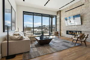 Living room with hardwood / wood-style floors and a fireplace