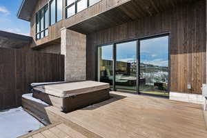 Wooden deck with a covered hot tub