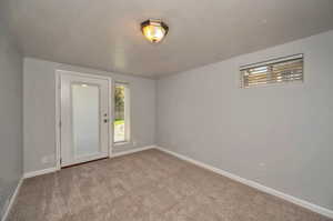 Empty room with light colored carpet