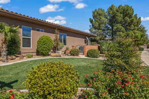 View of front of property featuring a front lawn