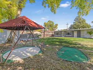 View of yard featuring a playground