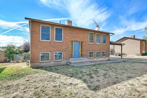 View of front of home featuring a front yard and a patio area