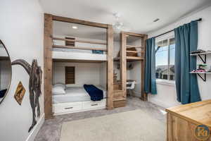 Bedroom featuring ceiling fan and carpet flooring