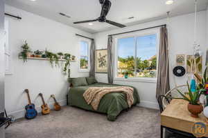 Bedroom featuring carpet floors and ceiling fan