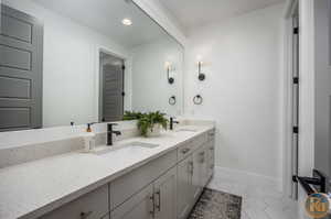 Bathroom featuring vanity and tile patterned floors