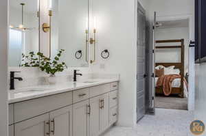 Bathroom with tile patterned flooring and vanity