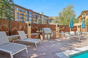 View of patio featuring a grill and an outdoor kitchen