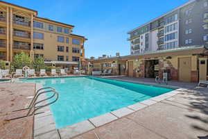 View of swimming pool featuring a patio