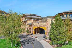 View of front of house featuring a balcony and a mountain view