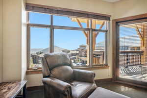 Living area with carpet and a mountain view