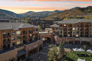 Aerial view at dusk featuring a mountain view