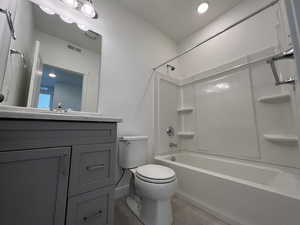 Full bathroom featuring shower / washtub combination, tile patterned flooring, vanity, and toilet