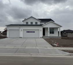 View of front facade with a porch and a garage