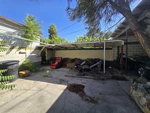 View of patio / terrace with a carport