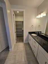 Bathroom featuring tile patterned floors and vanity