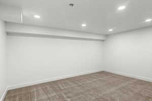 Basement with carpet flooring