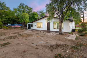 View of front of home with cooling unit