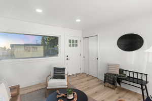 Living area with light wood-type flooring