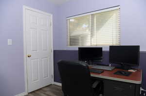 Office space featuring new LVP flooring and a textured ceiling