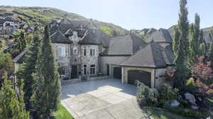 View of front of home featuring a mountain view and a garage