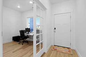 Office area featuring light hardwood / wood-style floors