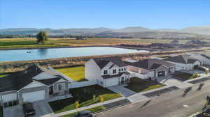 Aerial view featuring a water and mountain view