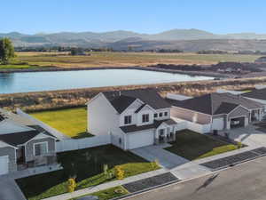 Aerial view featuring a water and mountain view