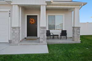 Doorway to property with a yard