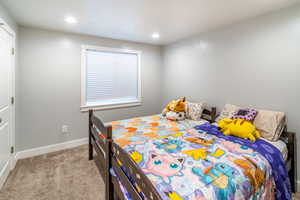 Bedroom with light colored carpet