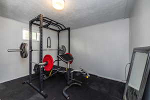 Exercise area with a textured ceiling