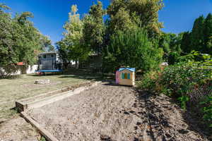 View of yard featuring a trampoline