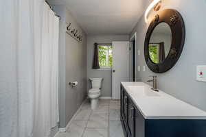 Bathroom with vanity and toilet