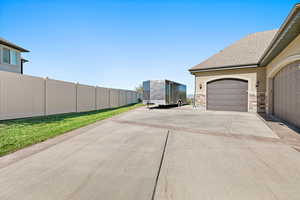 View of yard with a garage