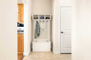 Mudroom featuring light tile patterned floors