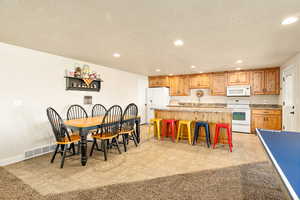 Dining space with a textured ceiling