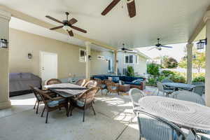 View of patio featuring an outdoor hangout area and ceiling fan