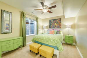 Bedroom featuring light carpet and ceiling fan